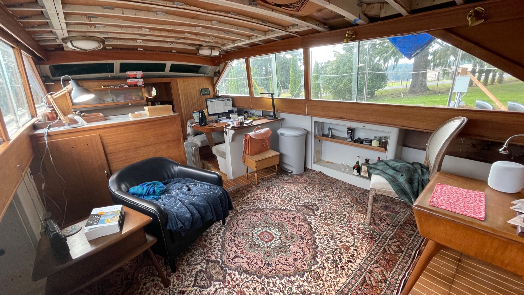 Wood-paneled salon inside the Chris Craft during restoration