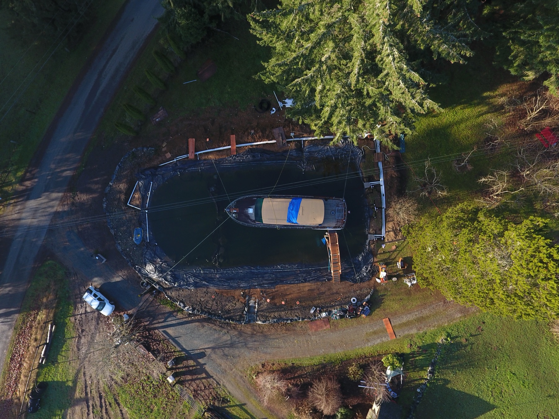 Top-down aerial view of the pond excavation and Chris Craft