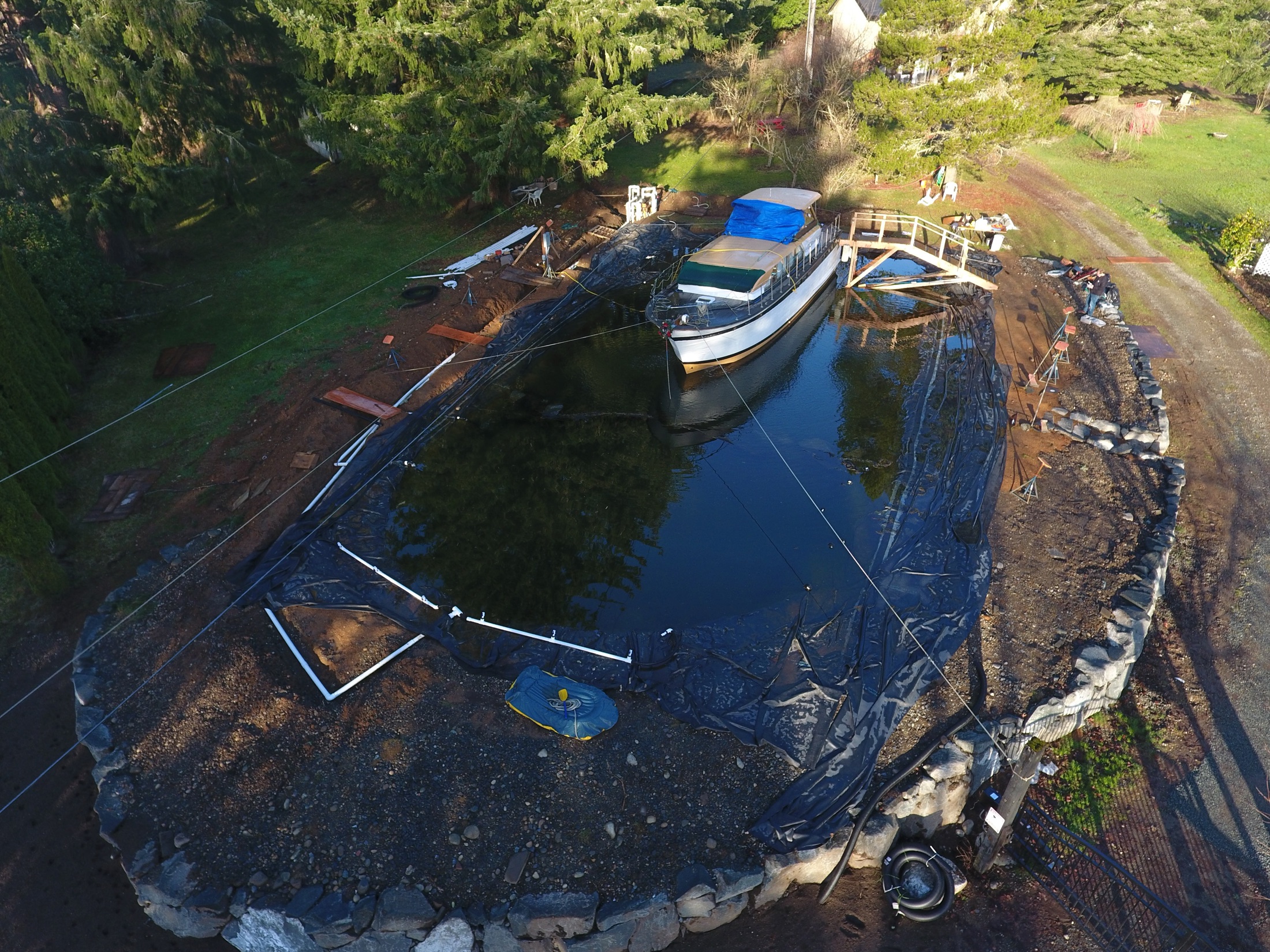 Aerial view of the Daybreak Farm pond under construction around the Chris Craft
